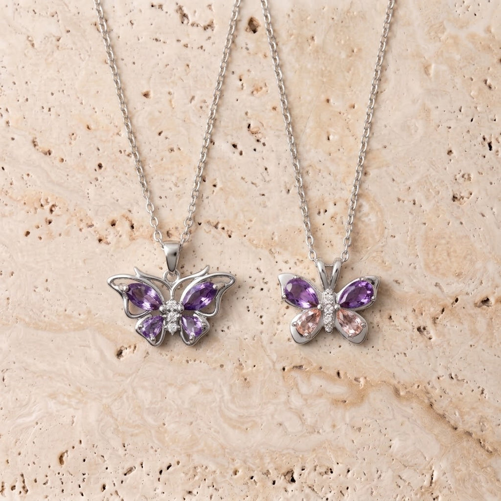 Set aus Schmetterling mit offenen Flügeln und zweifarbigem Schmetterling